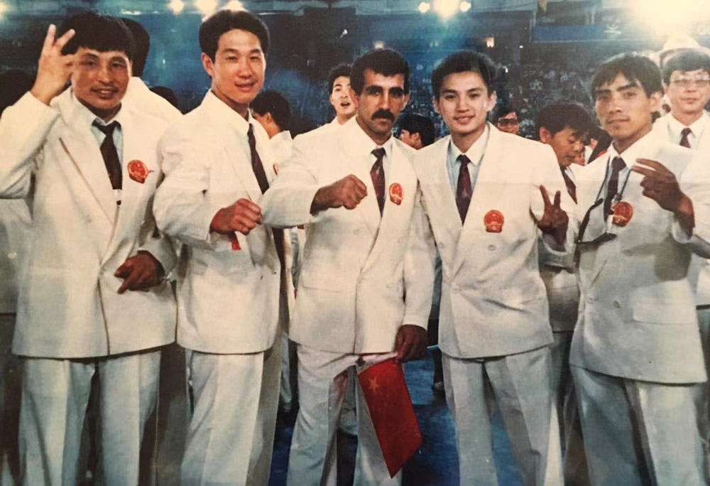 China's first Olympic boxing team are pictured at the Barcelona Games in 1992. Their Cuban coach Pedro Diaz is in the center, while Liu Gang stands to his right.  Courtesy of Liu Gang