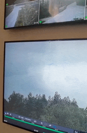 A GIF from a surveilance screen shows the plane falling down. From Weibo
