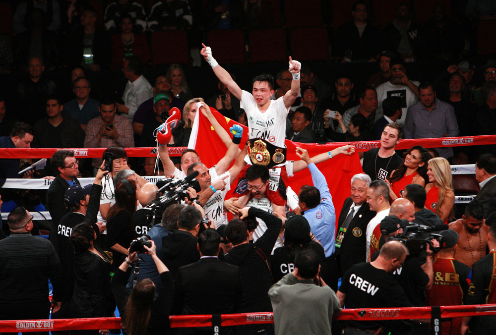 Xu Can celebrates in the ring after his victory over Jesus Rojas, Jan. 26, 2019. The WBA world championship belt is around his waist. Courtesy of Liu Gang