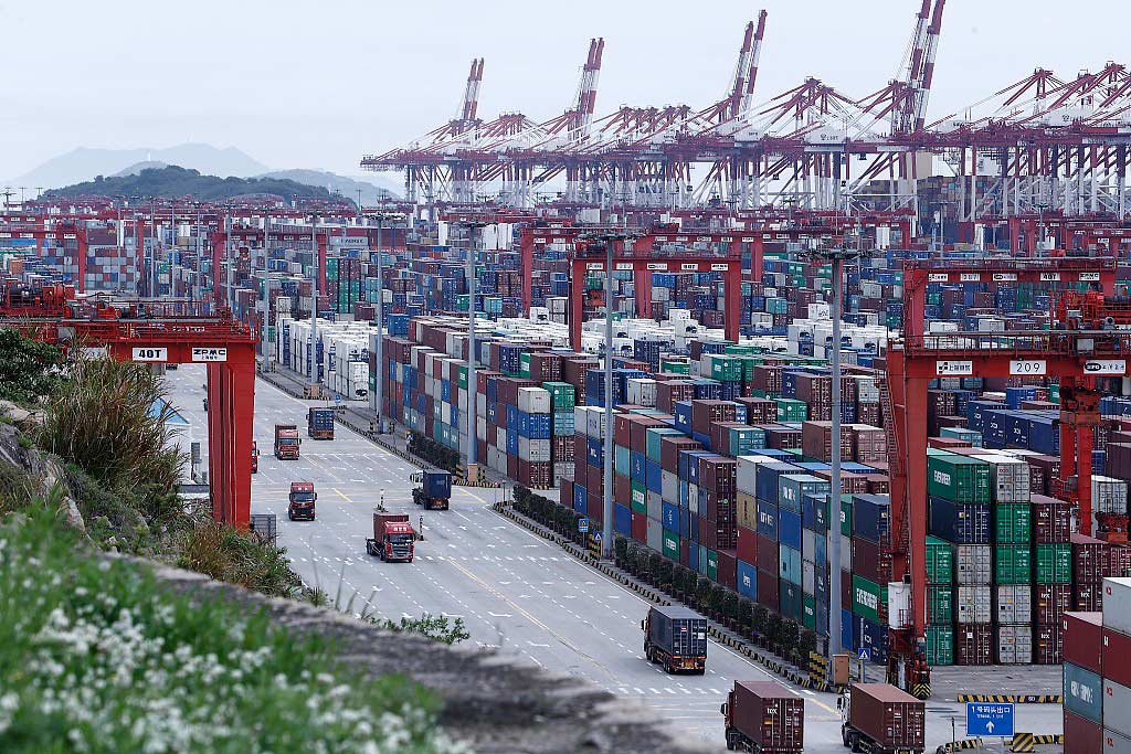 Trucks pass through Yangshan Deep Water Port, April 24, 2022. Yin Liqin/CNS/VCG