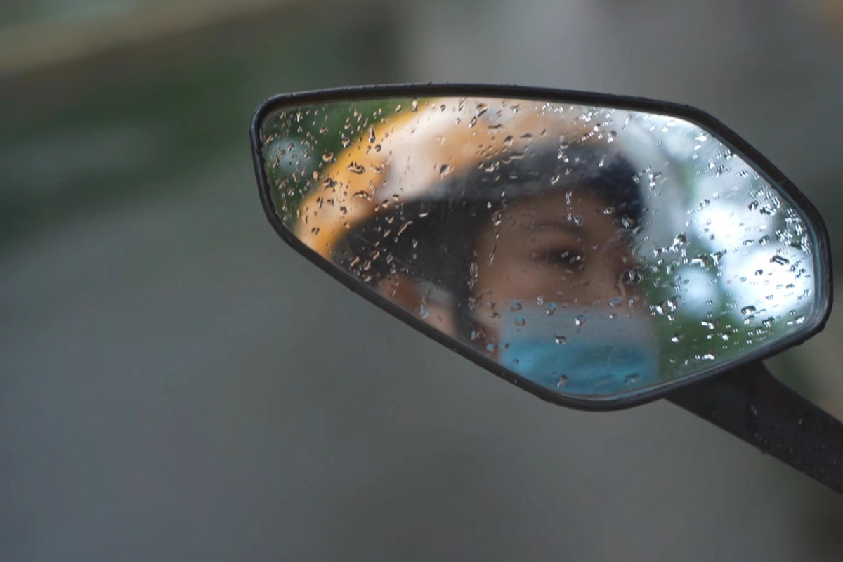 A rider delivers packages on a rainy day in Shanghai, 2021. IC