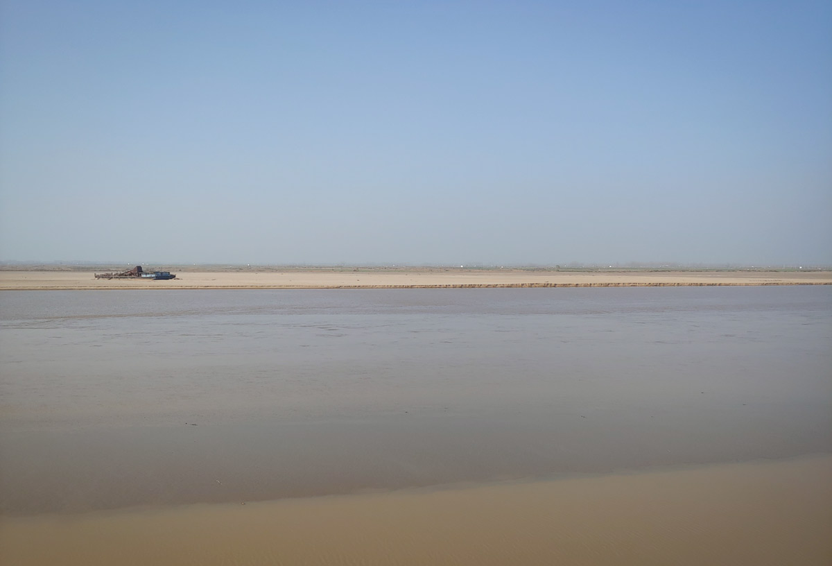 A beached ship in a dried-up section of the Yellow River near Kaifeng, Henan province, 2019. Today, the river is increasingly unable to support transportation or irrigation. Courtesy of Ruth Mostern