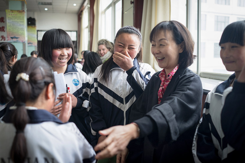 Ching Tien greets the female students she has sponsored through EGRC at No. 2 High School in Min County, Gansu province, April 6, 2016. Courtesy of Olivia Martin-McGuire