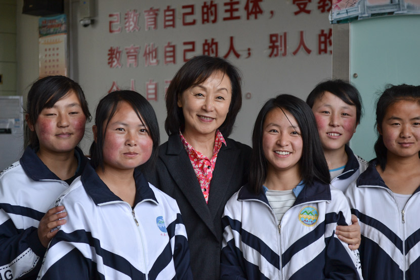 Ching Tien poses for a photo with students sponsored by EGRC at No. 2 High School in Min County, Gansu province, April 6, 2016. Courtesy of Olivia Martin-McGuire