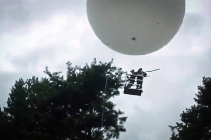 A screenshot from a video advertisement demonstrates how to pick pine nuts using a balloon. From Hangzhou Chiny Aircraft Technology Co. Ltd.