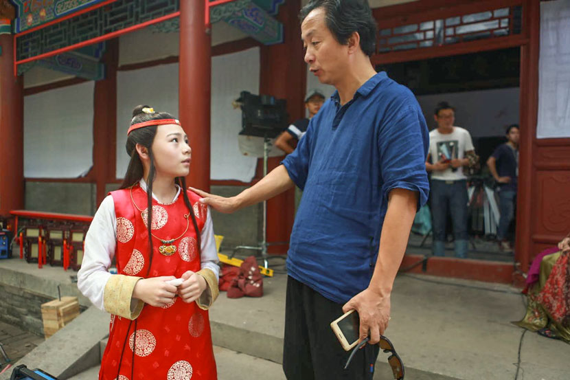 Pan Liping (right) talks to young actor Shi Xiaosong on the set of ‘Dream of the Red Chamber’ in Jinhua, Zhejiang province, 2017. Courtesy of Pan Liping