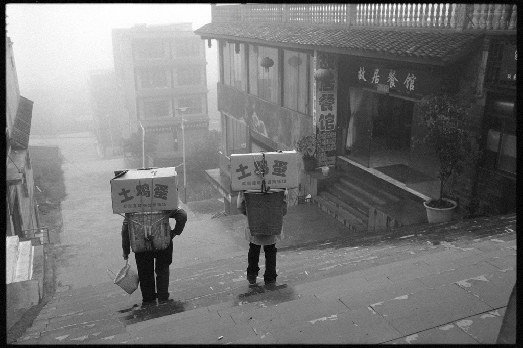 Villagers carry boxes of eggs in Xingyi, Guizhou province, 2018. Courtesy of Andrew Wong