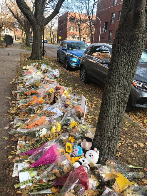 Bouquets of fresh flowers, dolls, and cards from his friends lay on the spot where Zheng was killed. Courtesy of Li Rong