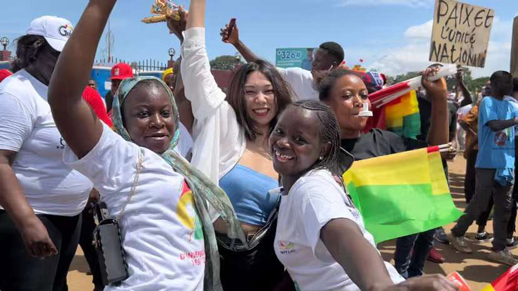 Li Yao poses with local people during a national holiday event in Guinea, Oct. 2, 2022. Courtesy of Li Yao