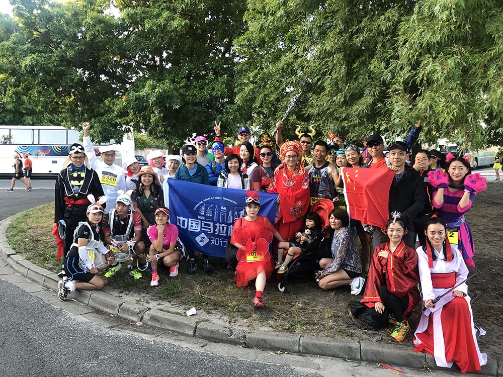 Chinese runners pose for a photo at Marathon du Medoc, a race that combines drinking wine with running, in France, 2018. Courtesy of ZX Tour