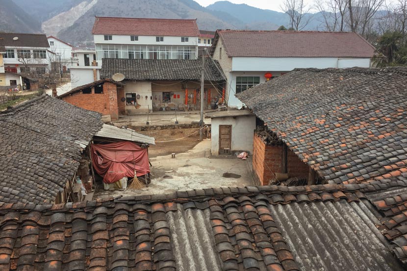 A view of the Wang family’s courtyard (with the red cloth) from the second floor of the Zhang family home in Wangping Village, Shaanxi province, Feb. 20, 2018. Wang Jian for Sixth Tone