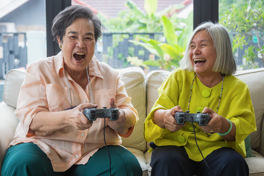 Elderly people with technology gadget, play video game. Seni