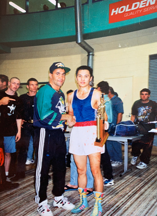 Liu Gang poses for a photo with Australian professional boxing legend Jeff Fenech after winning an amateur bout in Australia, 1994. Courtesy of Liu Gang