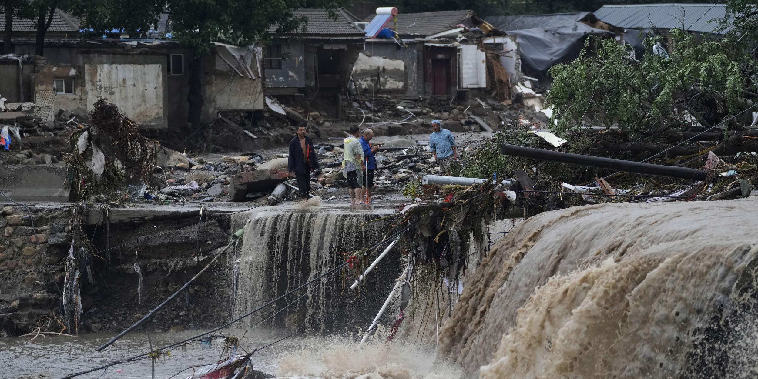 Extreme Floods Hit Beijing 11 Dead Residents Cut Off